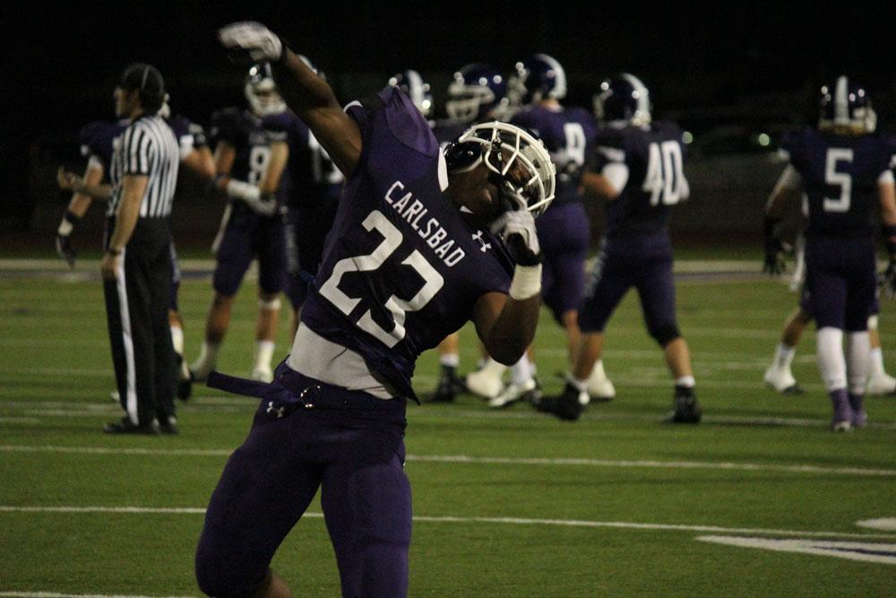 Senior Shawn Cameron throws a fist into the air, frustrated with the Lancers last play. 