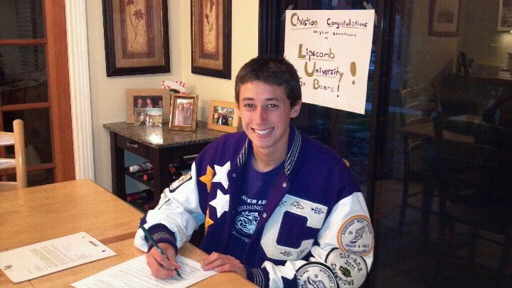 Senior+Christian+Freeman+signs+his+letter+of+intent+at+his+home+on+Feb.+7+to+Lipscomb+University+in+Tennessee.++He+will+be+running+track+and+cross+country+for+the+university+starting+in+the+fall.