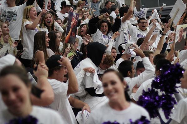 The crowd at the boys varsity basketball game goes wild after the 10th point of the game was scored. ASB promoted a White Out game and asked fans to remain silent until the boys scored 10 points.