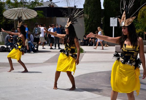 From bottom to up Seniors Leslie Calas, Bibiana Mejia and, Alondra Lua performed a Polynesian dance on May 3 during lunch. For Hawaiian day, their coach showed the school the culture of Hawaii.