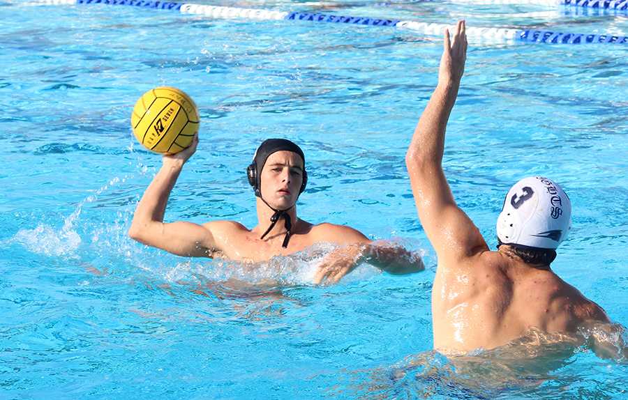 Senior+Owen+Asalone+prepares+to+fire+a+shot+in+his+game+against+Torrey+Pines.+Owen+has+been+playing+water+polo+since+age+seven+and+is+a+member+of+the+boys+varsity+water+polo+team.+He+has+hopes+of+carrying+his+team+to+victory+in+this+years+CIF+championship.+