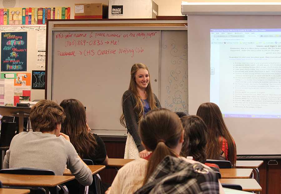 Junior Talia Cain speaks to her fellow creative writers in Creative Writing Club. Creative Writing Club gives students the chance to hang out with one another and write for a good time.
