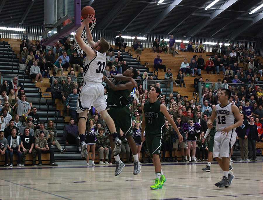 Senior Chase Ogden scores another basket, one of many the Lancers put up to add to the 68-46 victory over the Oceanside Pirates. The next home game is January 26th against, Fallbrook, and the Lancers are hoping for another victory to add to their record.