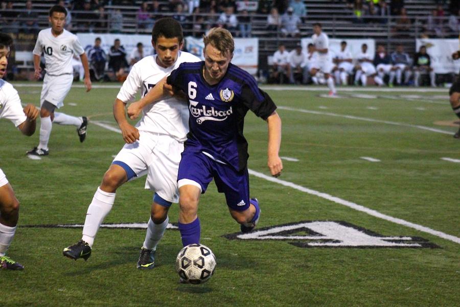 Starting the second half, senior Ethan Cowling manages to keep the ball away from Birmingham defenders.