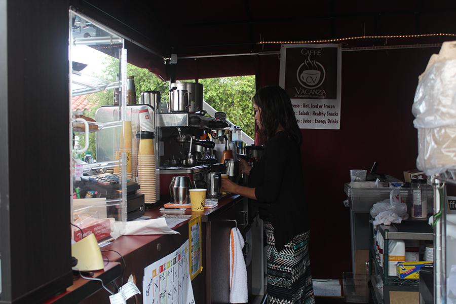 A barista at the new Cafe Vacanza brews a cup of coffee for excited customers. Vacanza is located off of Cannon Road by the Discovery Center.