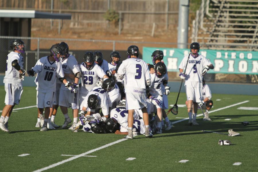 The boys dog pile each other after beating Scripps Ranch 15-10 in their first CIF win. 