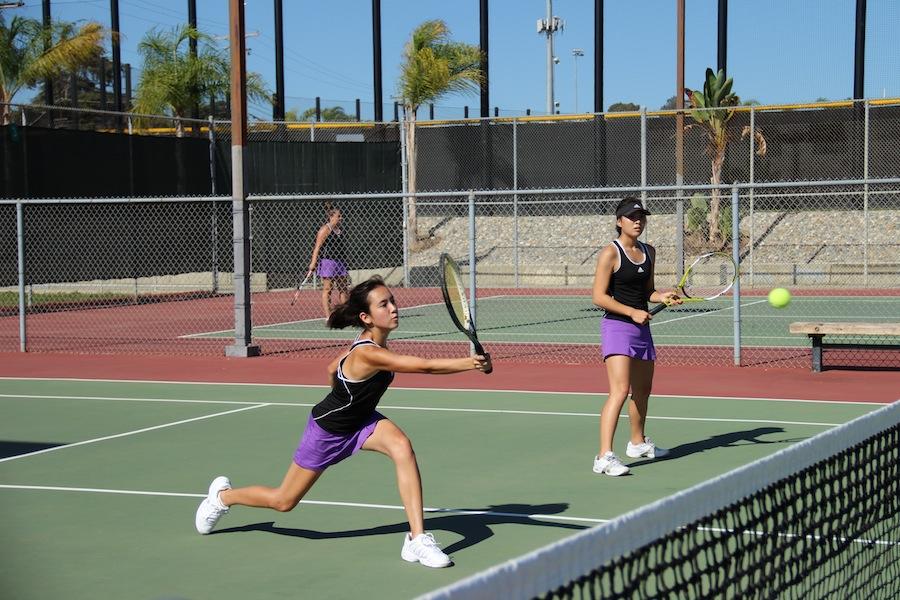 Junior Katlyn DeShon and senior Sandra Shin played doubles during the game against Vista. Lancers came out with a win by 11-7.