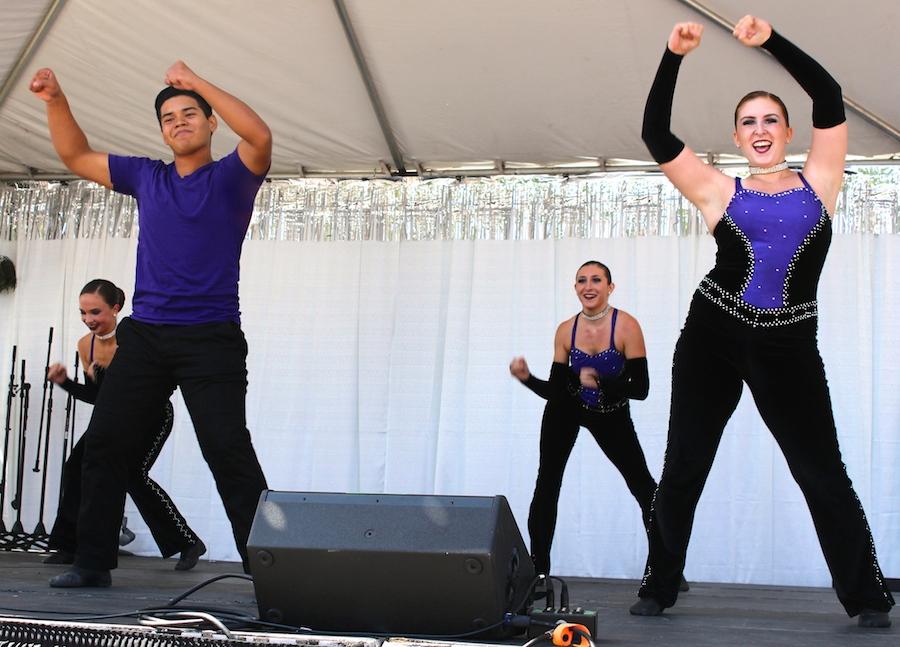 Juniors and members of XCalibur, David Rodriguez and Megan Schoen perform their routine with the rest of the team at Art Splash on Sept. 27.  Rodriguez enjoys bonding with his team as well as working hard to create fruitful routines.