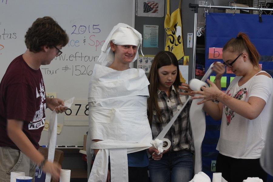French club celebrates Halloween by wrapping up the members as mummies. French club meets every third Tuesday of the month at lunch in room 6201.