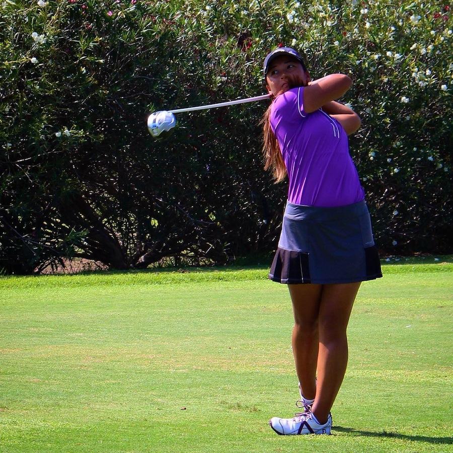 Senior Shannon Oh takes a swing during a golf game.  Oh was partly inspired to play golf by her yearning to possibly meet pro golfer Adam Scott.