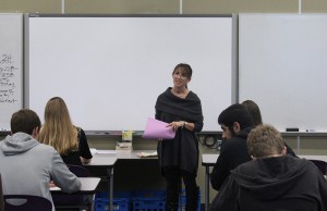 Mrs. Nasser talks to her students about an upcoming quiz on the novel they are reading.