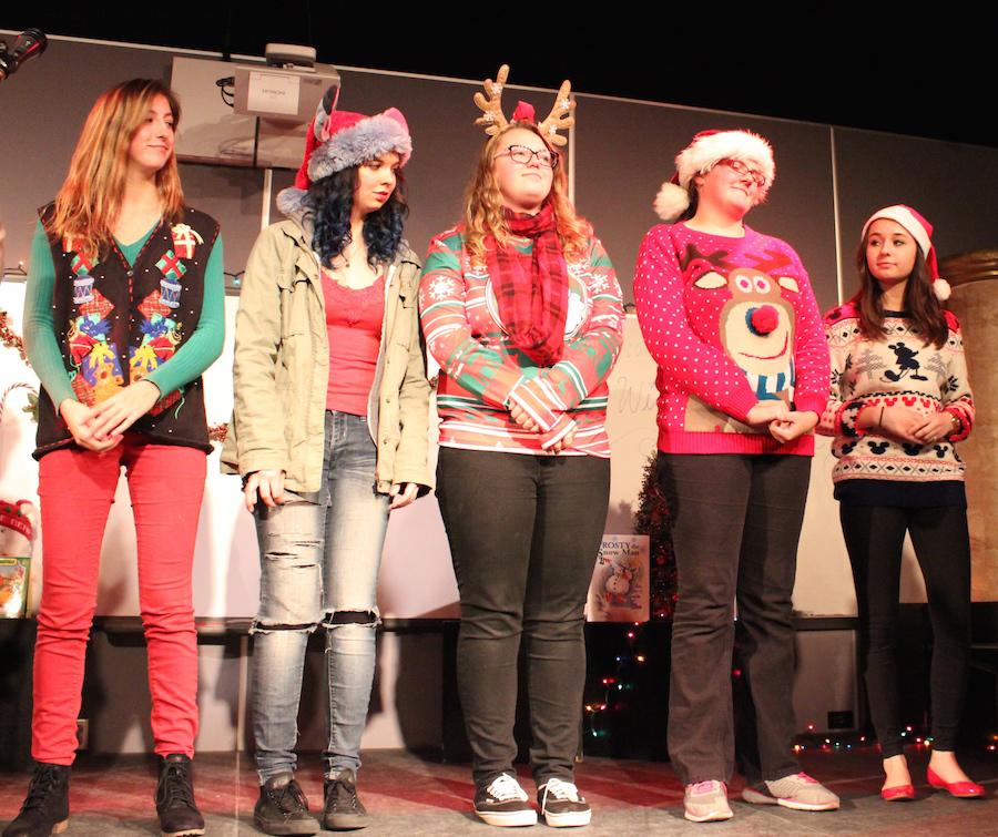 Members of Drama club compete in a most spirited holiday dressed competition during Coffee House Night.  The night was filled with numerous activities from singing to games to yummy food from many clubs and audience participants.