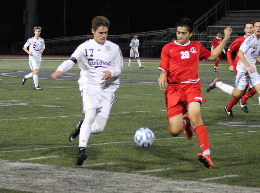 Senior Emilio Bunnell races to get the ball before a Fallbrook player can gain possession. Later on, Emilio scored the only goal in the game grabbing a win for Carlsbad.