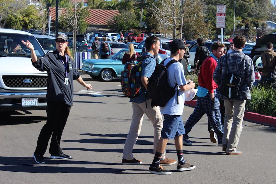 One of CHS security officers directs the flow of traffic from students and parents as the lockdown from an anonymous threat is temporarily lifted for students to leave.  The threat was made off a social media account and Dr.Porter along with other CHS staff is working in conjunction with the Carlsbad Police Department to ensure our safety.