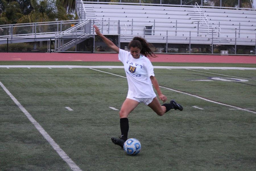 Junior%2C+Yasmin+Ahooja%2C+sets+up+to+take+a+practice+shot.+Yasmin+plays+outside+midfield+and+has+played+on+the+varsity+team+since+she+was+a+freshman.