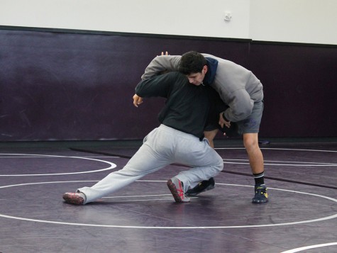 Senior, Josh Jeetan, wrestles his teammate to prepare for their CIF playoff matches. As always, Lancers are hoping to obtain a victory this year.
