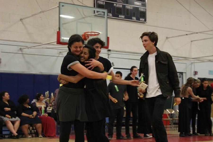 A group of four advanced theater students celebrate their award after competing in the category Shakespeare Villains with a scene from Othello. 