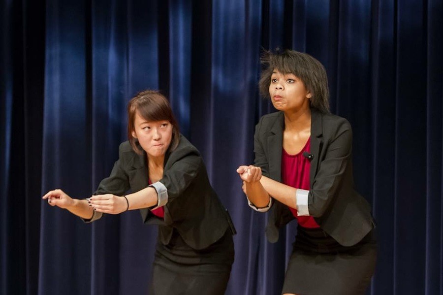 Speech and Debate member Emmy Kim and Nefertiti Orimiloye perform a duo interpretation at their end of the year showcase held at Dove Library.