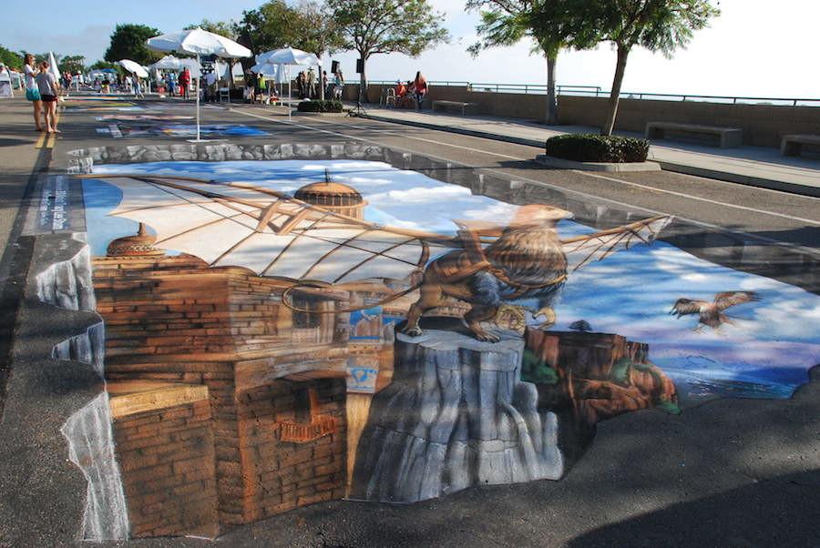 Artists display their talent in chalk drawings. This artist created a 3D piece in order to present a more realistic drawing.