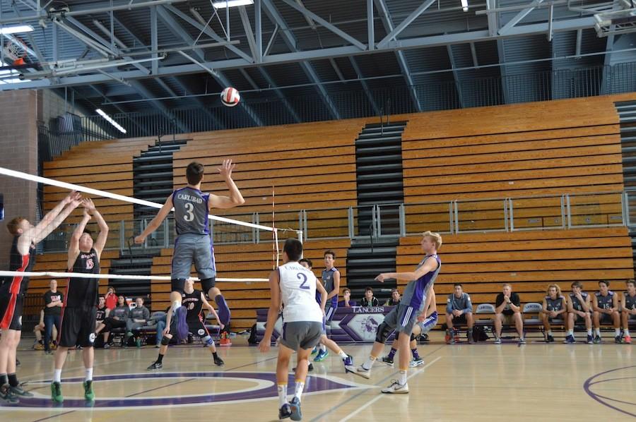 Senior, Braeden Waumans, spikes the ball against Canyon Crest Academy on Tues, Mar. 22. The Lancers dominated Canyon Crest Academy, the score coming out to 3-0.