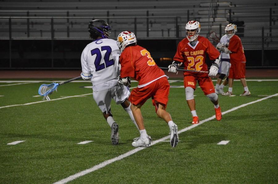 Junior, Jeremy Cooper, attacks Mount Carmels defense with full force, attempting to get a shot off. After a hard fight through the whole game, the Sun Devils took the win, the score coming to 5-6. 