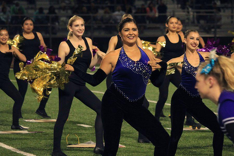 Senior Delena Cruz performs during the homecoming halftime show. The Lancer Dancers danced to a mix of song from across the decades. 