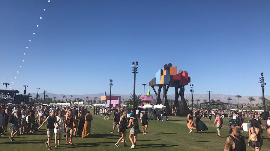 Festival attenders walk around and enjoy the beautiful decorations and art pieces. Coachella had great photo ops at many art pieces all around the festival grounds.