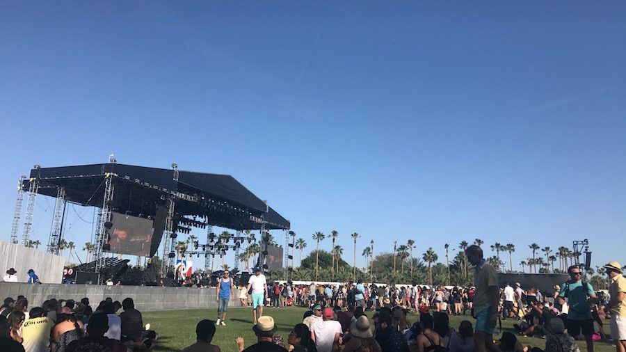 People gather around the Coachella outside stage in anticipation of a performance. Artists performed in front of hundreds of people at the festival.