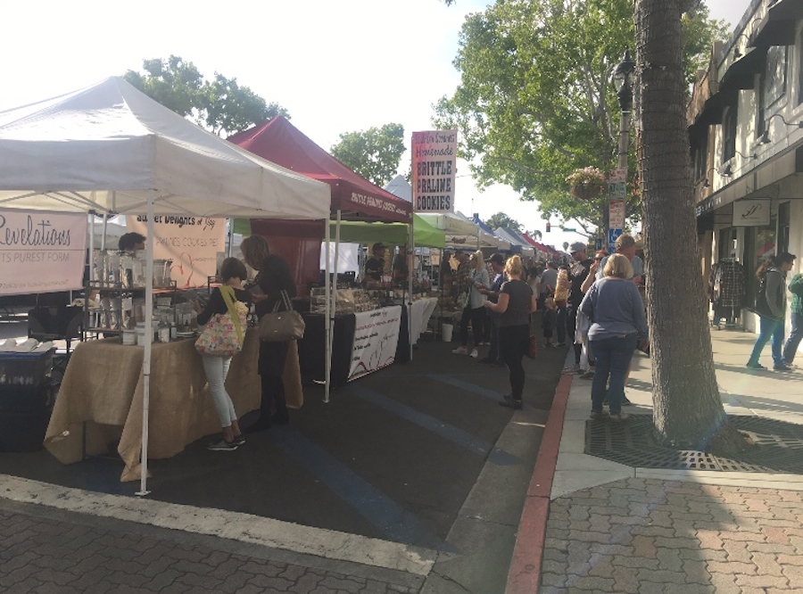 Carlsbadians buy local produce at the Carlsbad Farmers Market. The Farmers Market is every Wednesday from 3 to 7pm on State Street in Carlsbad Village promoting local businesses and community gathering. 
