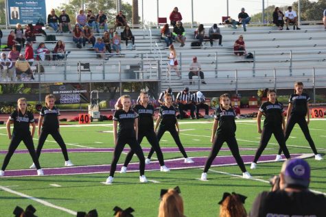 X-Calibur starts out their halftime dance during the JV football, Friday, Sept. 15. The dancers work to excite the crowd for the second half of the game.