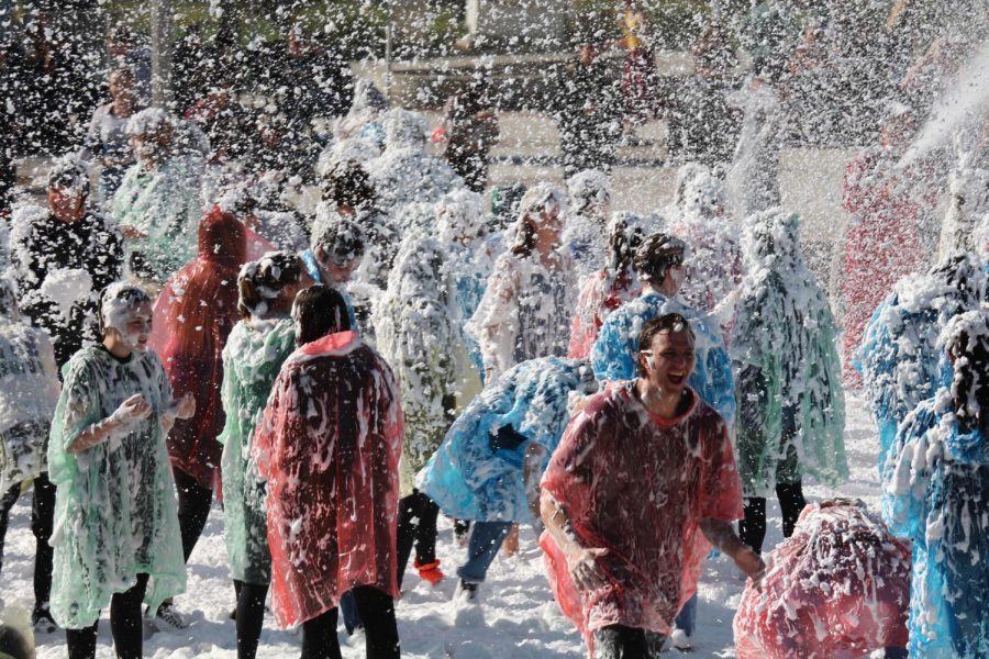 Students are covered in foam during Blizzard 3.0 at lunch, Thursday, Dec. 14. Free ponchos and treats were given to students to celebrate winter.