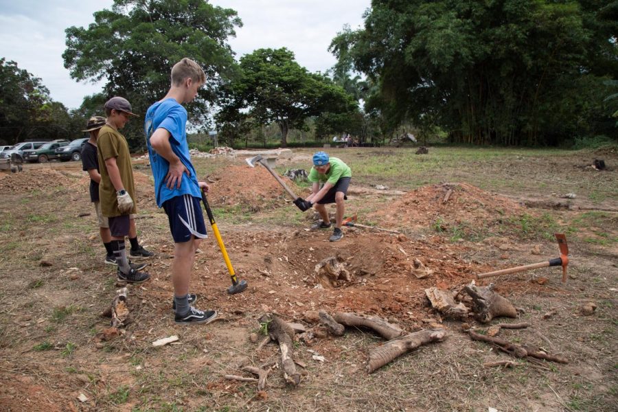 Sophomore Christian Young works on a service project in Peru
