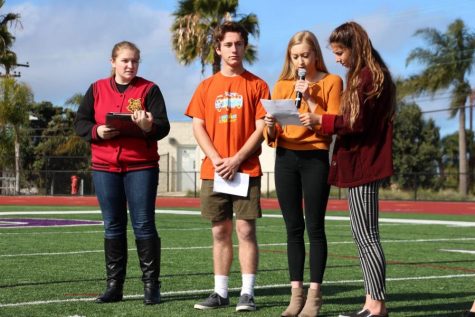 Students walk to the football field during the National Walkout to honor the victims of the Florida shooting. Hundreds of students participated in peaceful protest, including Democrat Club president, senior Dillan Krichbaum (second to left). 