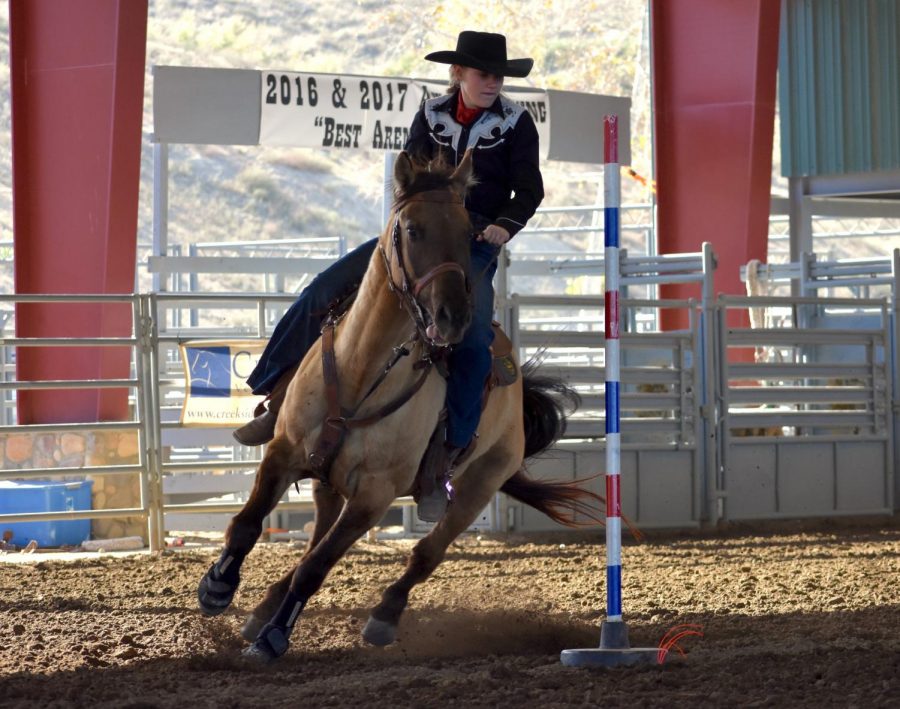 Sophomore Juliane Balog competing with his horse Koda. Balog competes in the California Highschool Rodeo.