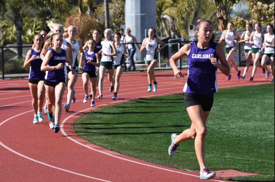 Sophomore Allie Tanita leads the pack in the girls 1600 yard run. Tanita ended up winning the event, leading in all four laps. 
