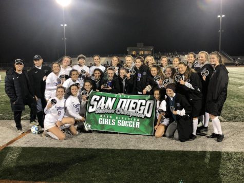 Varisty girls soccer poses with their Open Division trophy and banner. The game finished 1-0 Lancers with a goal from sophomore Lexi Wright in the second half.