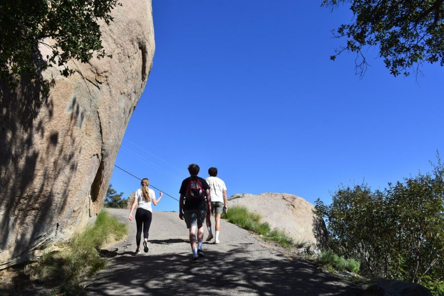 Hikers of the three mile trail follow a steep paved path all the way to the rock.  The trail is quick to gain elevation.