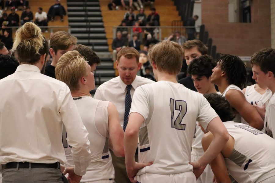 Coach+Eshelman+gives+the+boys+varsity+basketball+team+their+play+to+run+for+the+next+possession.+Carlsbad+won+the+game+89-44.+