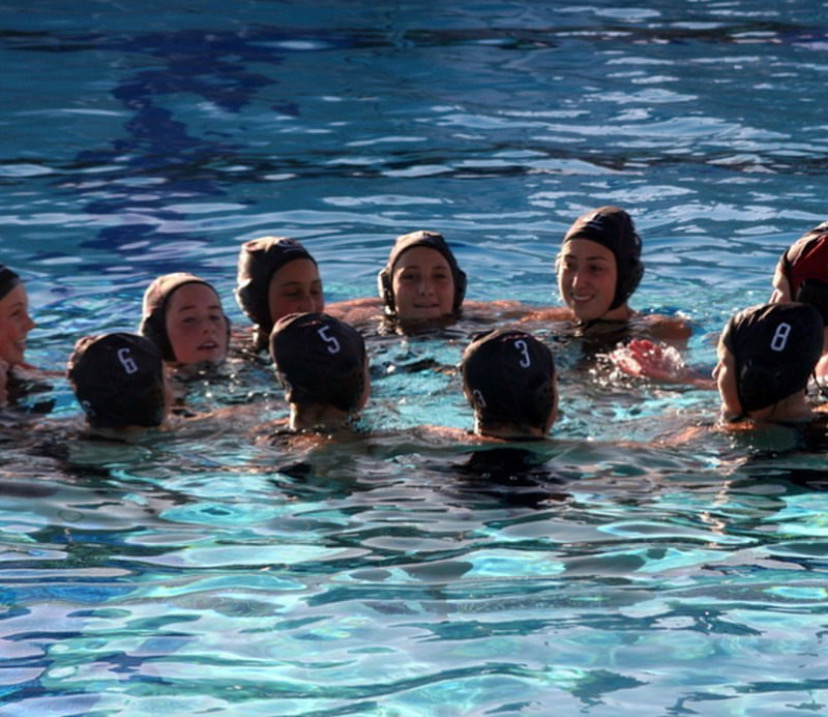 Girls varsity water polo huddles up in CIF finals against the Bishop High Knights. 