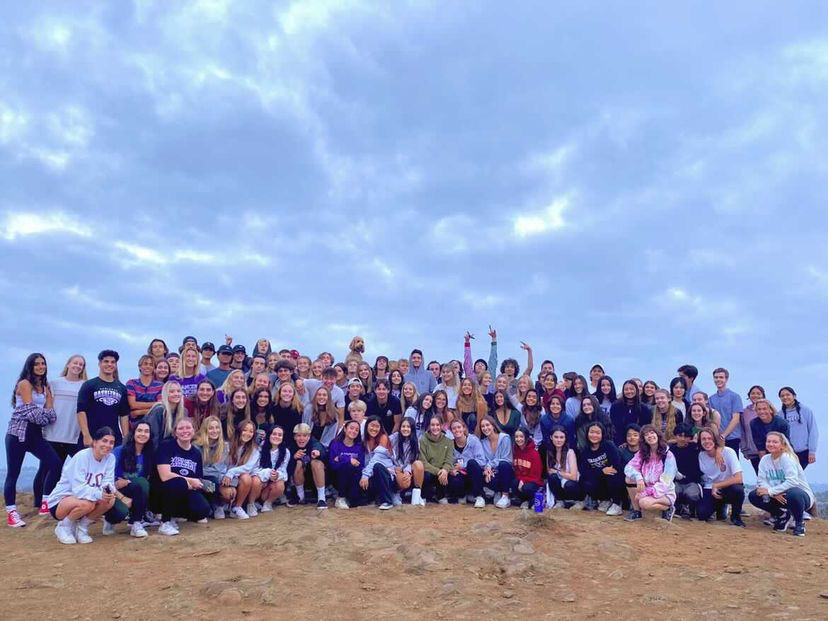 The senior class poses for a photo at the top of Calavera Mountain at the annual Senior sunrise.