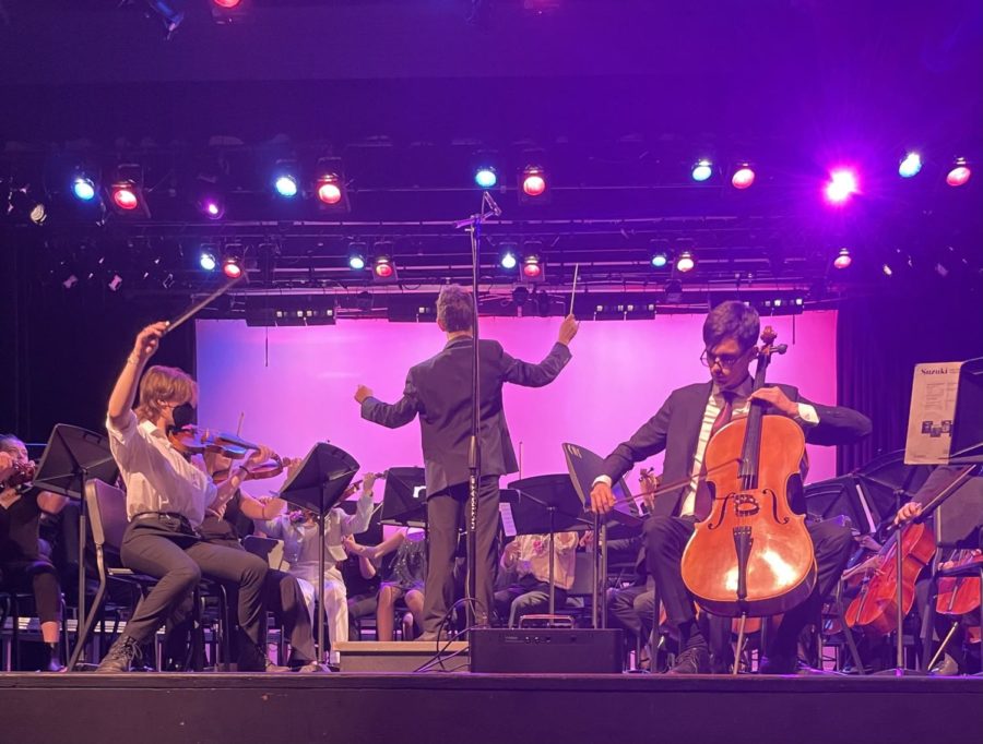 Orchestras+last+concert+of+the+year+gave+some+students+the+opportunity+to+take+the+spotlight.++Freshman+Vassilios+Dresios+conducts+the+CHS+Chamber+Orchestra+while+seniors+Josie+Dominguez+%28left%29+and+Luke+ONeill+%28right%29+play+their+instruments.+