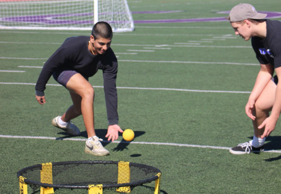 In Spikeball, there are two players per team. The object of the game is to hit the ball into the net so the opposing team cannot return it.