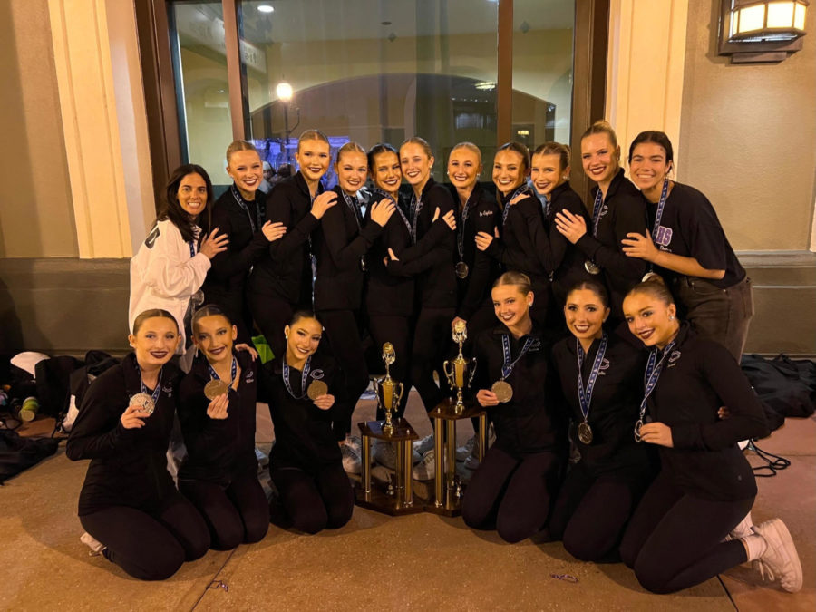 The+CHS+varsity+dance+team+holds+their+second+place+medals+in+Florida+at+nationals.