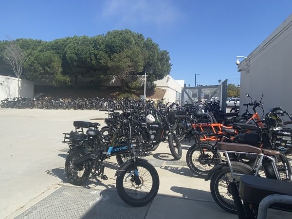 There are many e-bikes parked at the bike racks at Carlsbad High School due to their growing popularity amongst students.