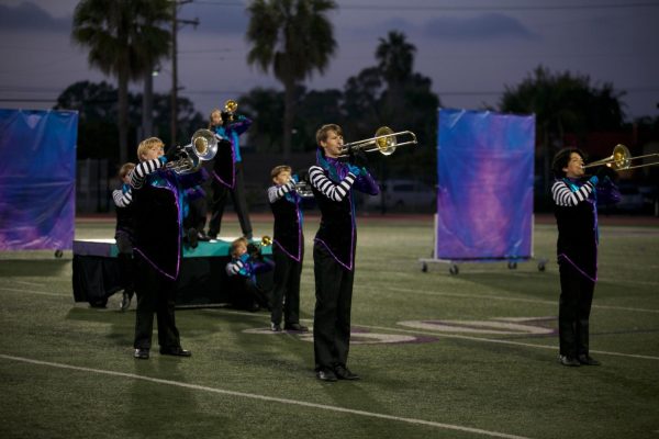Marching band students perform their Wonderland-themed production during one of their many practices. 