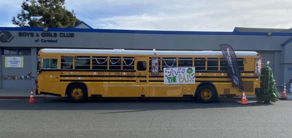 Bus that holds the donated toys outside of the Boys and Girls Club Village Clubhouse