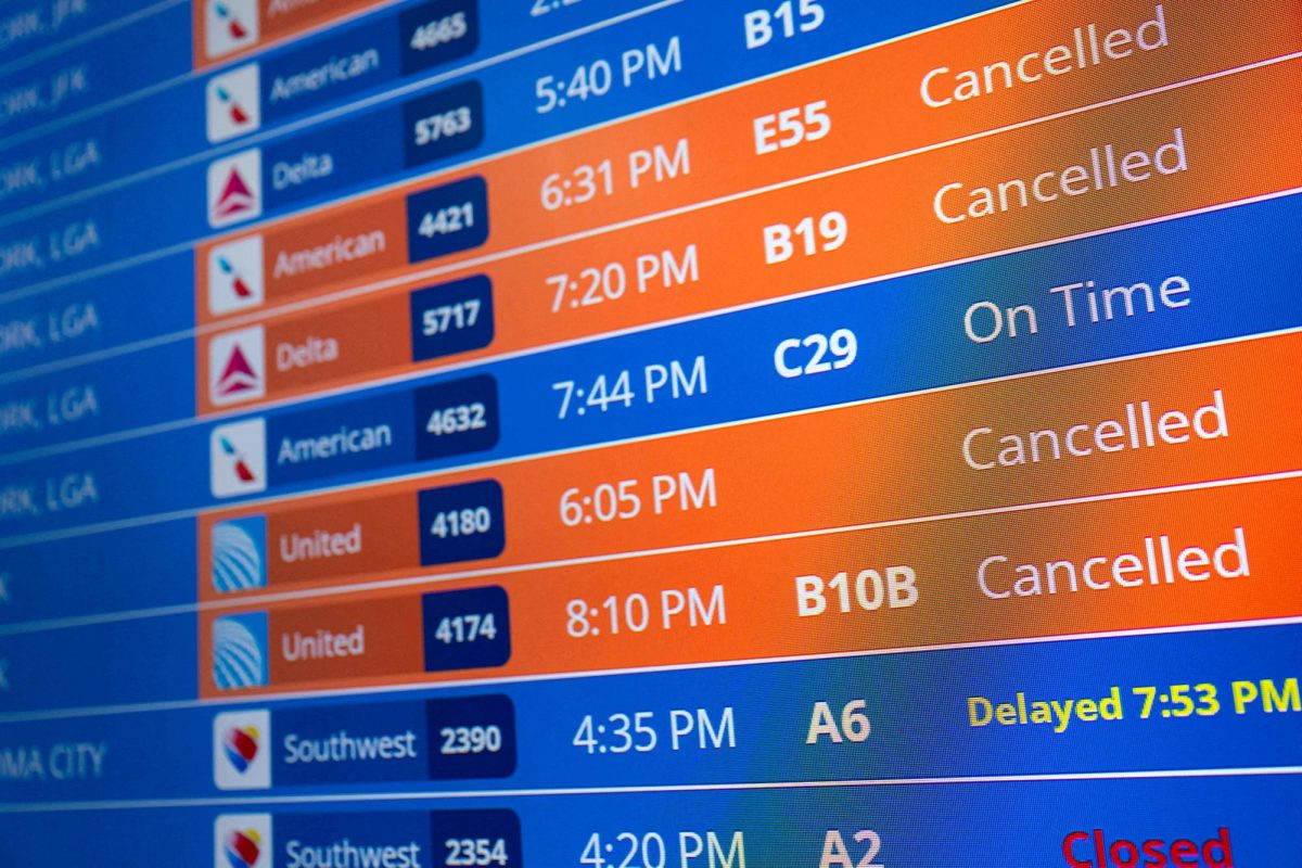 Flight timings and cancellations are displayed on the departures board, a month into the ongoing U.S. government shutdown, at Ronald Reagan Washington National Airport in Arlington, Virginia, U.S., November 9, 2025. REUTERS/Annabelle Gordon