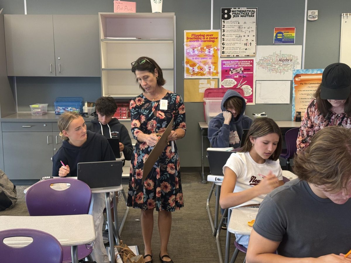 In math class, Michelle Alfonso reviews quadratics with her students before a test.