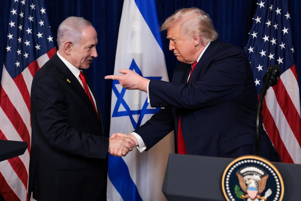 U.S. President Donald Trump points his finger towards Israeli Prime Minister Benjamin Netanyahu as they shake hands during a press conference after meeting at Trump’s Mar-a-Lago club in Palm Beach, Florida, U.S., December 29, 2025. REUTERS/Jonathan Ernst
