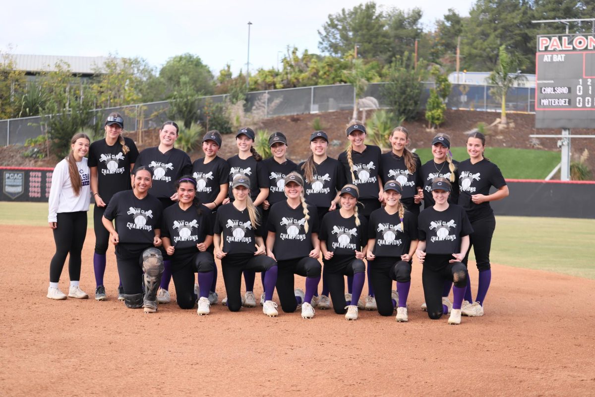 The varsity softball team at Palomar College after defeating Mater Dei in the diamond bracket of the Cougar Classic tournament. 